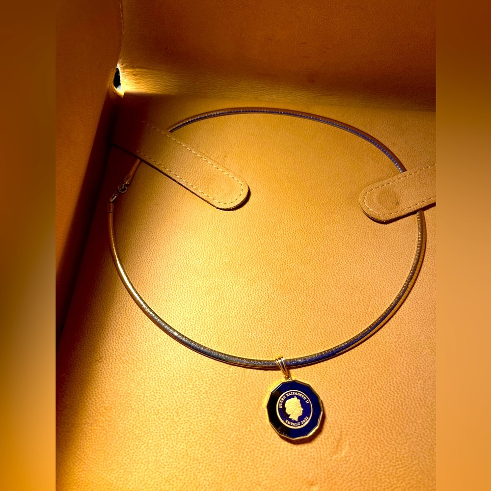 14k Omega necklace with 24k gold pendant .Patented by a well-known designer.